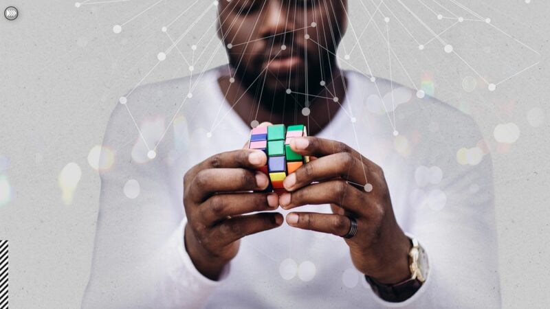 Black man with Rubik's cube